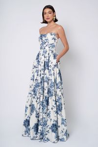 The Sutton dress is a garden party unto herself! Her chic straight neckline gives way to playful and versatile detachable puff sleeves, and her tiered skirt is nothing if not romantic!