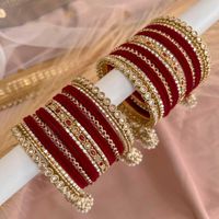 2 medium stacks of luxurious antique Gold bangles with deep maroon shades and multi jhumka drop detail end bangles. Perfect for brides or those wanting to make a statement. Ready to Ship!