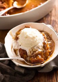 Butterscotch Pudding (Self Saucing) in a bowl with ice cream, ready to be eaten