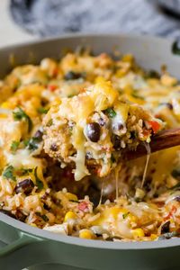 These Southwest Chicken Rice Bowls feature plenty of colorful veggies, diced chicken, perfectly cooked U.S.-grown rice, corn, black beans, salsa and lots of tasty spices! It’s a one pan meal, makes great leftovers and is a delicious, easy dinner! #southwestchicken #chickenrecipes #chickenricebowls #easydinners #southwestchickenrecipe #krollskorner 