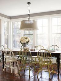 Multi-colored dining room chairs. Can choose a color? Pick them all!...need to find chairs, then Cover Store to find different pastel paints...motivated yeah