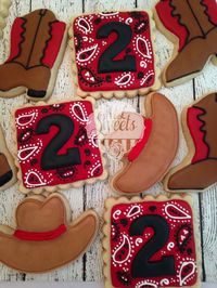 Cowboy sugar cookies, with cowboy boots, cowboy hats and paisley cookies.