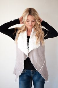 These Shearling vests are so soft you won't want to take them off! Each vest features a suede fabric on the outside and a faux fur lining. Oh, and did we mention it has pockets!