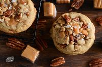 These cookies have it all: sweet, salty and crunchy! We started with a brown sugar chewy cookie base and added a handful of toffee bits, chopped pecans, caramel bites and sprinkled them warm out of the oven with flaked sea salt.