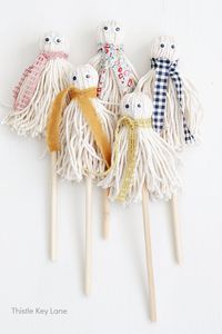 Easy Yarn Ghosts DIY - Make yarn ghosts for Halloween with stylish fall scarves, and wiggly eyes that are just too cute to be scary.