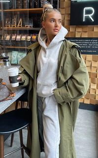 This trench coat is sure to elevate any outfit of the day. Featuring a khaki premium woven material with a hood and an oversized fit, we're obsessed. Wear over your existing wardrobe pieces for a chic finish to any look.   Length approx 131cm/51.5 (Based on a sample size UK 8)   Model wears size UK 8/ EU 36/ AUS 8/ US 4   Model Height - 5ft 6