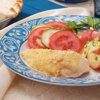 Baked Swiss Chicken Recipe- Recipes  Canned soup, white wine, Swiss cheese and crushed croutons dress up chicken breasts in this elegant entree from Beverly Roberge. Ideal for unexpected guests, it only requires a few ingredients. "The creamy sauce is excellent with garlic mashed potatoes or rice," says the Bristol, Connecticut cook.