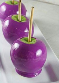 So cute!! I would put black sprinkles on the top and a witch hat over the stick and make a face with icing.you could even make a pointed nose out of part of an apple with a black pearl for the wart.