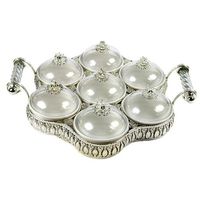 This is a very beautiful sectional 7 piece serving tray. It is made of a combination of ceramic, metal and glass tops. Image doesn't do justice. It is very pretty and will get lots of attention at your parties. Color: Silver.