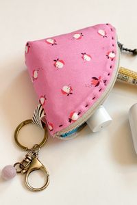 This mini coin purse designed by Minki Kim is perfect for holding those loose items on a keychain. Learn how to sew up a mini coin purse on the blog at weallsew.com.