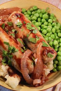 Bangers and mash are served with an onion gravy for a classic staple in British and Irish cuisine; hearty and comforting on a cold blustery day.