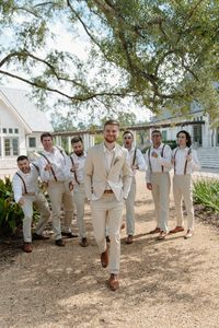 Khaki groomsmen attire, suspenders groomsmen, fun groomsmen photo prompts, walking groomsmen photo, outdoor louisiana wedding