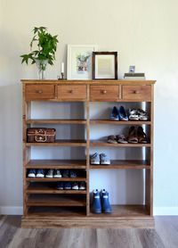 "This cabinet features: - Solid Wood construction - Shelves in varying heights, for tall boots, flats, kids' shoes, etc. - Four drawers at the top - Solid wood moulding This item is made to order, so you have several size options to choose from to make it your own. Please contact us if you would like a custom size. The cabinet pictured is 53\" high x 48\" wide x 12\" deep. The cabinet pictured has a Provincial finish. Hardware can be customized upon request. This is a handmade item, so there are