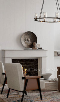 Fireplace Surround Mantel Oxford in cast stone by Artisan Kraft. Shop our link below for more cast stone fireplace mantel surrounds. Installed in a modern Mediterranean style home with a large Chandelier.