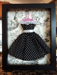 Put barbie clothes in shadow boxes for decor. CUTE girls' room idea!