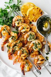 Garlic grilled shrimp skewers are marinated in a garlic herb mixture, then grilled to perfection in under 10 minutes!