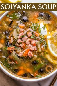 An easy Traditional Solyanka Soup Recipe. The hearty soup is loaded with ham, pickles, and olives served with fresh dill and sour cream. The soup joins our Beet Borscht for traditional Russian soup recipes.