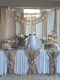 Used (normal wear), Dessert table backdrop with "love is sweet" sign. And table burlap pieces with 2 bows (can't find the 3rd bow). Burlap. Used for bridal shower.. Make an offer!