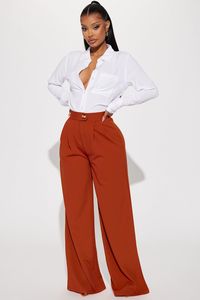 Available In Chocolate And Rust. Trouser Pant High Rise Button Detail Elastic Waist Back Front Pleats Wide Leg Stretch 95% Polyester 5% Spandex Imported | What Matters Most Wide Leg Trouser in Rust size XS by Fashion Nova