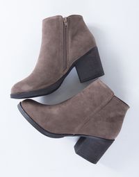 The Casual Suede Heel Booties are the type of boots you can wear on a daily basis. You will love the simple, yet classic style. Comes in a taupe and black color of your choice. Made from a smooth faux