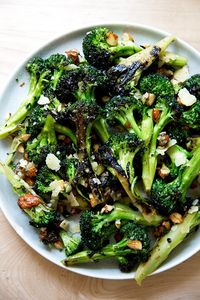 Charred — but not roasted — broccoli salad with dates, almonds and cheddar. This is such a refreshing change from roasted vegetables, and so incredibly delicious. It's a great make-ahead salad, because the broccoli remains firm even with time, and as it sits, it gets more delicious because the dates, almonds and cheddar soak up the dressing. So good. #broccoli #salad #almonds #dates #cheddar