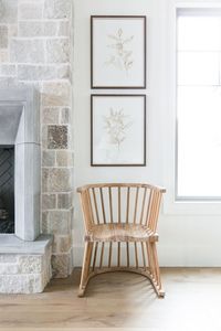 Stacked Coordinating Artwork with chair by fireplace - Studio McGee Design