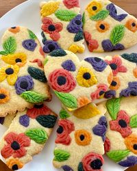 Floral cookies inspired by Rifle Paper Co designs.  Baked by Pop Fizz Confetti. Colour cookie dough flowers pressed into the plain cookie dough and edible pen to add detail.