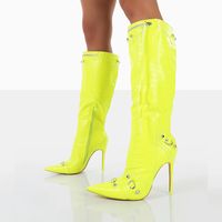 Elevate your style with these Neon Yellow Studded Knee High Boots. Featuring a pointed-toe design, zipper closure, and sleek stiletto heel, these boots make a bold fashion statement. Color: Yellow Heel Type: Stiletto heel Heel Height: 4.72" / 120 mm approx Product measurements were taken using size 8. Please note that measurements may vary by size. Toe: Pointed Toe Stud and buckle embellishment Handcrafted US sizing. Fits true to size.