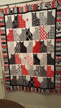 Black and white and red cat quilt