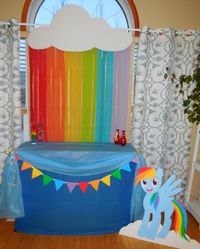 This rainbow cloud and rainbow dash were so fun to make.  I cut a cloud out of a very large piece of white card stock.  Then taped streamers across the back of the cloud.  It made a beautiful back drop for the cake table.