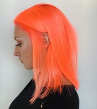 Hairstylists on Instagram have been using neon pink and orange dyes from Pulp Riot to create an incredibly vibrant look called neon peach hair for summer 2018.