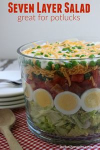 Heading to a potluck? Hosting a cookout? This Classic Seven Layer Salad Recipe is a MUST make! A crowd-pleaser for sure! It's super easy to make, can be made ahead and feeds a crowd!