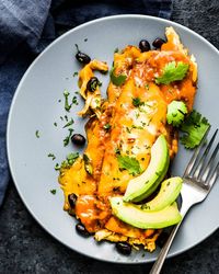 For the best chicken and black bean enchiladas, try this authentic Mexican enchiladas recipe. Chicken enchiladas with red sauce is savory and delicious.