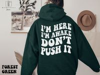 I'm Here I'm Awake Don't Push It Hoodie,  Hoodie with Words On Back, Aesthetic Hoodie,  Trendy hoodie, hoodies for women, funny hoodie,  If you are looking for soft and cozy hoodie, you're in the right place! Our unisex hoodies are heavy blend hooded sweatshirt. The material is a thick blend of cotton and polyester. This makes for a plush, soft feel alongside warmth. It's also a great surface for printing. There are no side seams.  A spacious kangaroo pocket hangs in front. The hood's drawstring