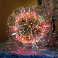 Sparkle Ball made with 9 ounce clear cups, staples and a string of 50 LED Christmas lights.