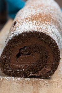 This Truffle Cake Roll is a death by chocolate cake with a ganache filling! It's the perfect cake roll recipe for chocolate lovers.