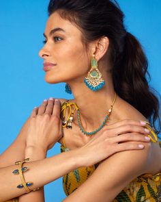 Timeless and elegant, our Aurelia Bangle evokes treasures of Troy. Regal yet discreet, it may be worn to adorn a sun dress (like our Flora Dress), statement gown (like our Electra One Shoulder Dress) or a casual poncho (like our Marbella Poncho).• Flexible frame• Slip on with opening• Gold plated • Blue colored faceted glass• Hand-crafted • Height: 1.625" • 1.1 oz • Zinc free • Made in India SHOP ALL JEWELRY Item #3WJRY-JN-204 Flora Dress, Blue Plates, Faceted Glass, Gift Bag, Sale Items, One Shoulder Dress, Hand Crafted, Gold Plate, Bangles