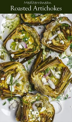 roasted artichokes on a white plate with herbs