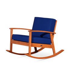 a wooden rocking chair with blue cushions