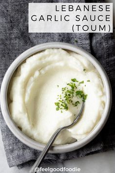 a bowl filled with mashed potatoes and garnished with parsley