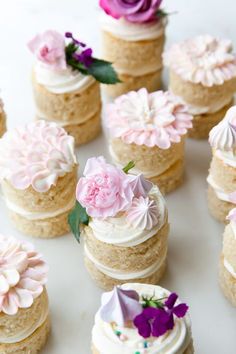 there are many cupcakes with flowers on them