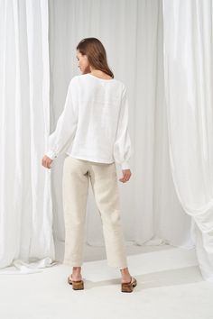 "No time capsule wardrobe could be complete without this distinctive pair of linen pants. DELANEY is a structured, classic pair but the pants could be rolled up to achieve a business-casual look. FABRIC: 100% softened Lithuanian linen COLOR: Please choose a color on the side menu. STYLE: Softened linen pants with hidden hook and eye and zipper closure at the front. Features folds on the front and side pockets. If you need another style, length, or color, please contact us. SIZE CHART: 2 US/ 6 AU Women Linen Shirt, High Waisted Linen Pants, Balloon Sleeve Shirt, Pants For Woman, Culotte Pants, Linen Shirts, Linen Blouse, Linen Trousers, Feminine Design