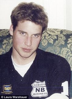 a young man sitting on top of a couch