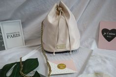 - Brand : Prada  - Luxury brand items - Authentic Prada Baby Pink Nylon Tessuto Small Bucket Drawstring Bag - Silver-tone hardware - Made in China - Size: W 16.5 cm x H 21.5 cm x D 10 cm - Come with a chain strap, not original Prada's chain strap ( for variety of use) - Overall in very good condition - With our own store packing will be included - Guaranteed 100% authentic - Free Shipping - We shipped worldwide! {Gentle Reminder} - Vintage Luxury Brand Store from Hong Kong - Pre-loved vintage it Prada Mini Bag, Prada Hobo, Prada Pink, Prada Mini, Bag Prada, Small Buckets, Prada Nylon, Bag Silver, Brand Store