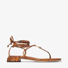 The Onyxia flat sandal is a modern, strappy silhouette crafted from snake print leather. Designed with a flattering wrap-around ankle strap, this style is punctuated by faceted Diamond links in a gold finish. Color Cobrizo, Bridal Boots, Sneaker Dress Shoes, Gold Snake, Scarf Jewelry, Mens Fragrance, Women Fragrance, Beauty Gift, Printed Leather