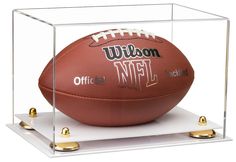 a football in a glass case with the words nfl on it