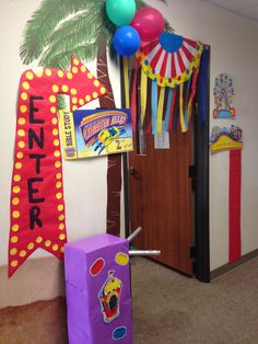 the entrance to an office decorated with balloons and decorations