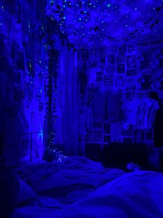 a bedroom with blue lights on the ceiling