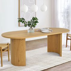 a wooden table sitting on top of a white rug