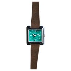 This small vintage women's watch by Rof Prestige is a real jewel of summer elegance. Its sea green background, ideal for summer, brings a touch of freshness and sophistication. The leather strap ensures optimal comfort and timeless style. Battery operated, this watch is both practical and reliable. Its square white metal dial adds a touch of modernity to its vintage design. Perfect for all occasions, this watch is a chic and refined accessory that will perfectly complement your outfit. Adjustable Green Analog Watch, Green Rectangular Watches For Formal Occasions, Green Watches With Leather Strap And Round Dial, Everyday Green Quartz Watch, Turquoise Quartz Watch For Gifts, Classic Green Watch With Leather Strap, Green Leather Strap Watch For Formal Occasions, Formal Green Watch With Leather Strap, Green Watch With Leather Strap For Formal Occasions